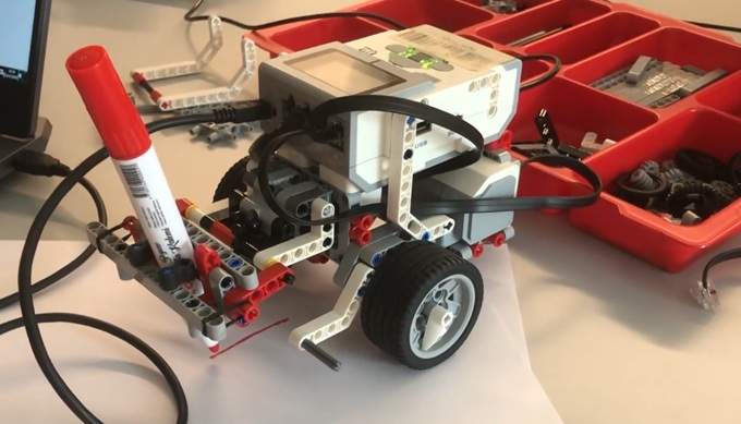 LEGO Mindstorms EV3 robot configured for a drawing task with motors and sensors